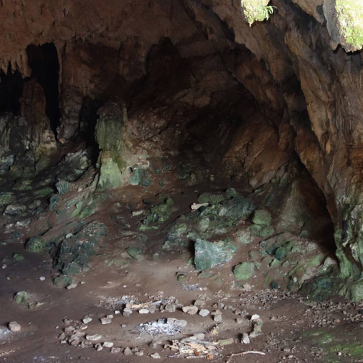 Korykio Andro interior with rugged rock walls and natural light 