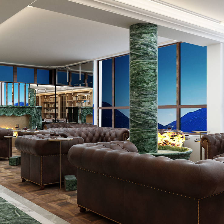 Cigar lounge with leather armchairs, marble details, and mountain view through panoramic windows