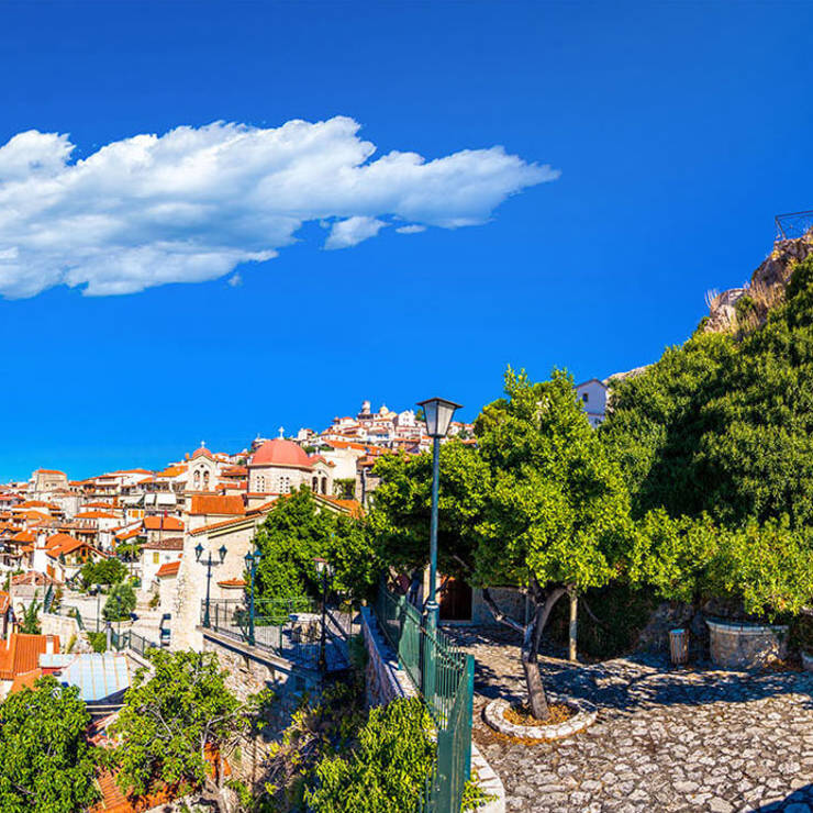 Panoramic view of Arachova village with red-roofed houses and the clock tower