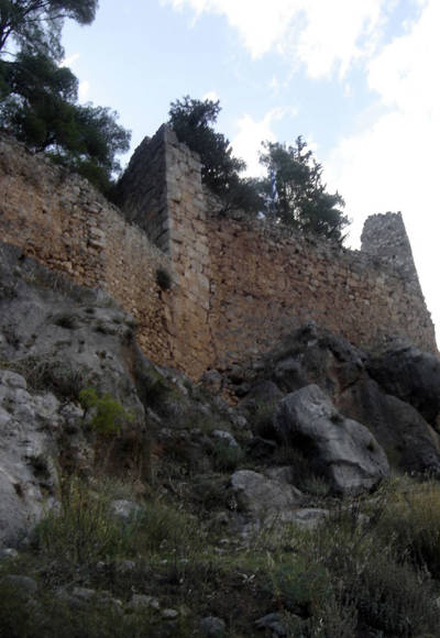 Historic castle of Amfissa standing on a rocky hill surrounded by green landscape