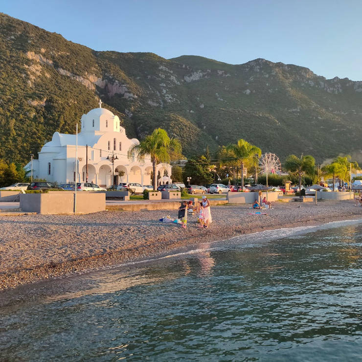White seaside church on the beach of Kamena Vourla
