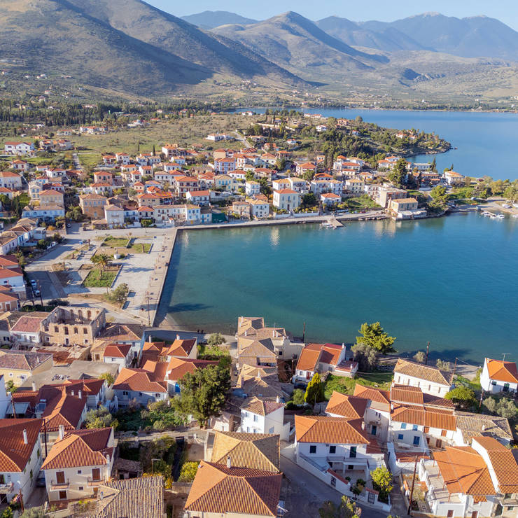 Aerial view of Galaxidi scenic square with traditional houses near the blue sea