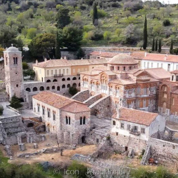 Panoramic view of the historic Monastery of Hosios Loukas nestled in lush green hillside scenery