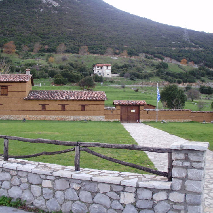 Historic Gravia Inn stone building surrounded by greenery, site of the famous 1821 battle