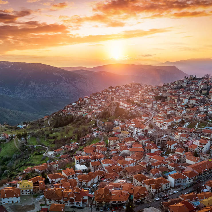 Sunset over Arachova village with red rooftops and mountain views