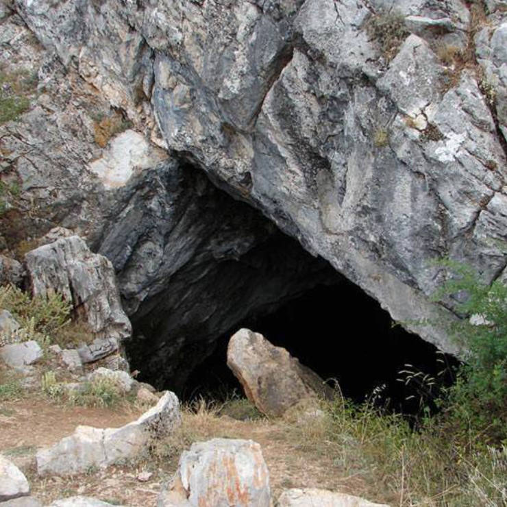 View of the Korykio Andro with rock walls and light filtering in from above